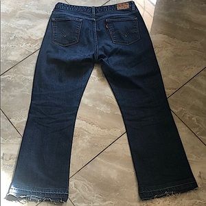 Levi’s mid rise boot 553 vintage flare, raw edged frayed bottom jeans